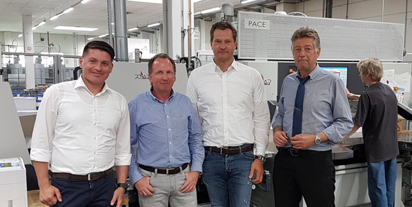 Marc König, postpress specialist of HD Germany, Marco Böke, managing director of druckpartner, Wilfried Munkelt, sales representative of HD Germany and Gerhard Florian, plant manager of druckpartner (fr. left to right)